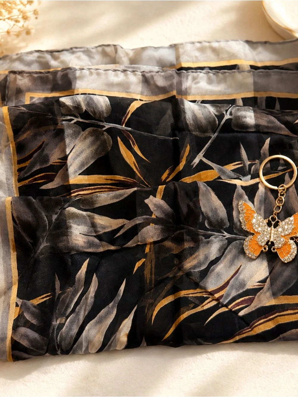 Elegant Black & Gold Leaf Print Women's Scarf with Butterfly Charm